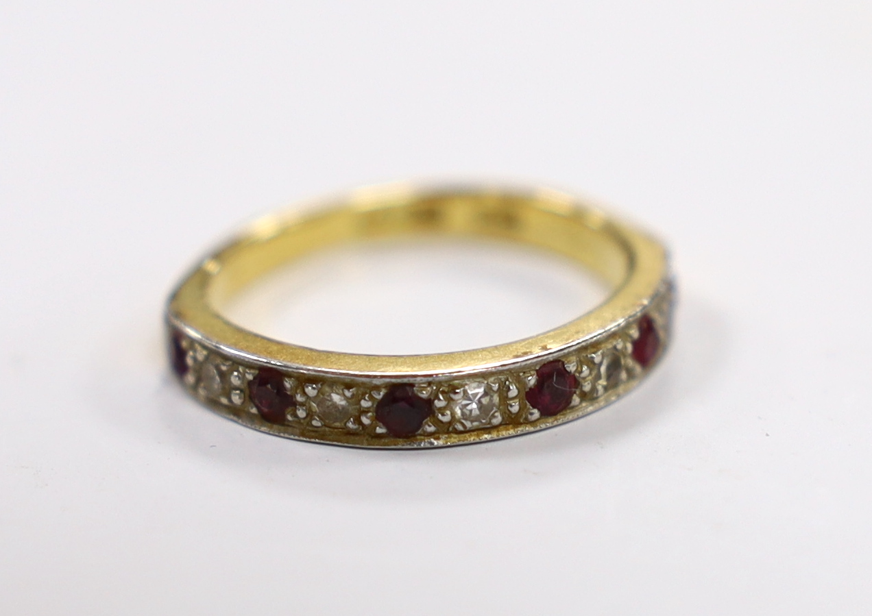 A 18ct and plat. six stone ruby and five stone diamond chip set half hoop ring, size L/M, gross weight 3.6 grams.